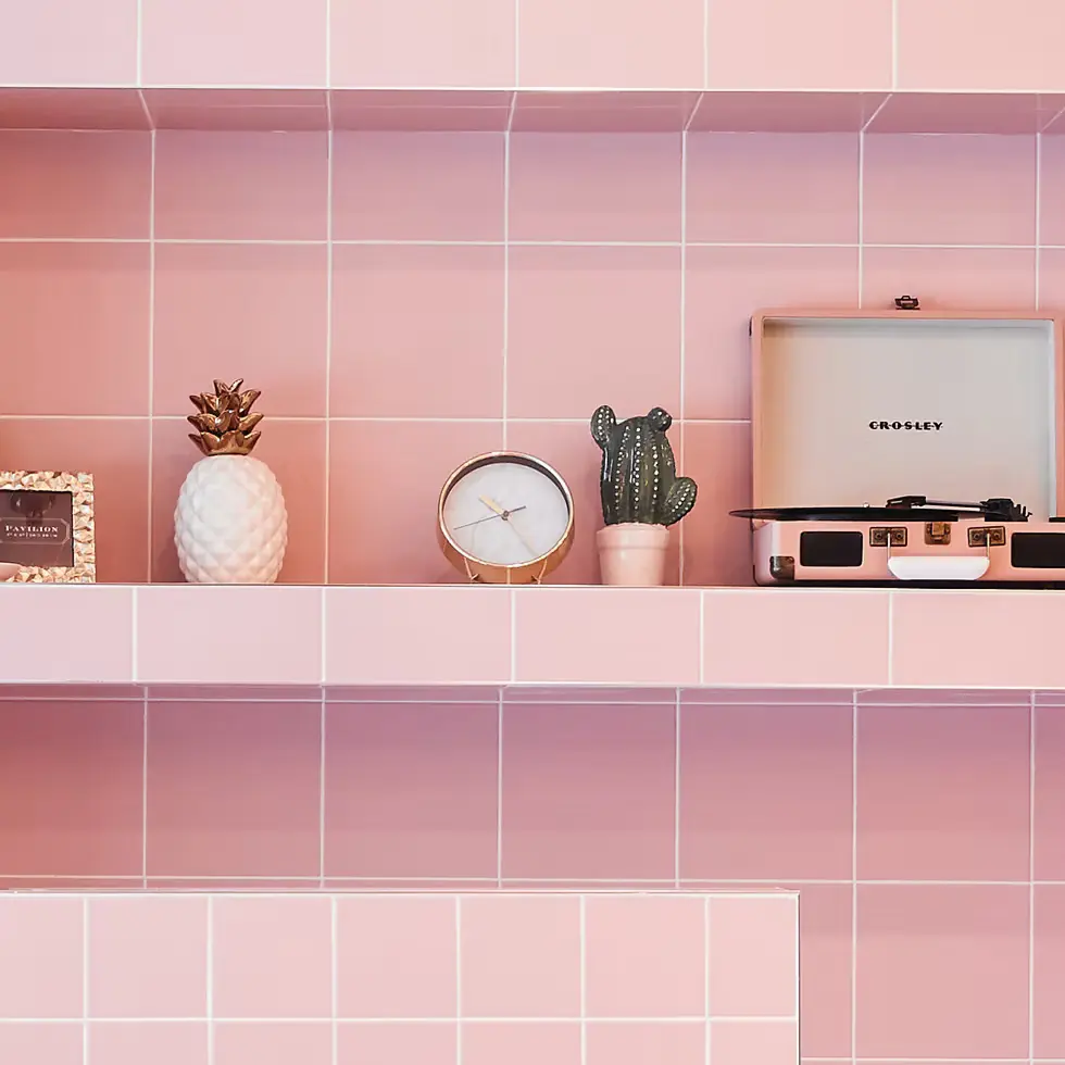 Interior Design - Crosley turntable placed on pink tiled shelves with decorative items including a clock and a cactus. Dexign Matter Studio