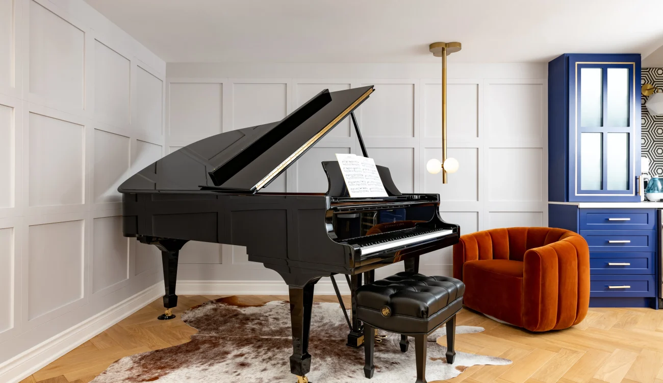 Interior Design - Black grand piano with sheet music on the stand and a matching bench in a modern interior. Dexign Matter Studio