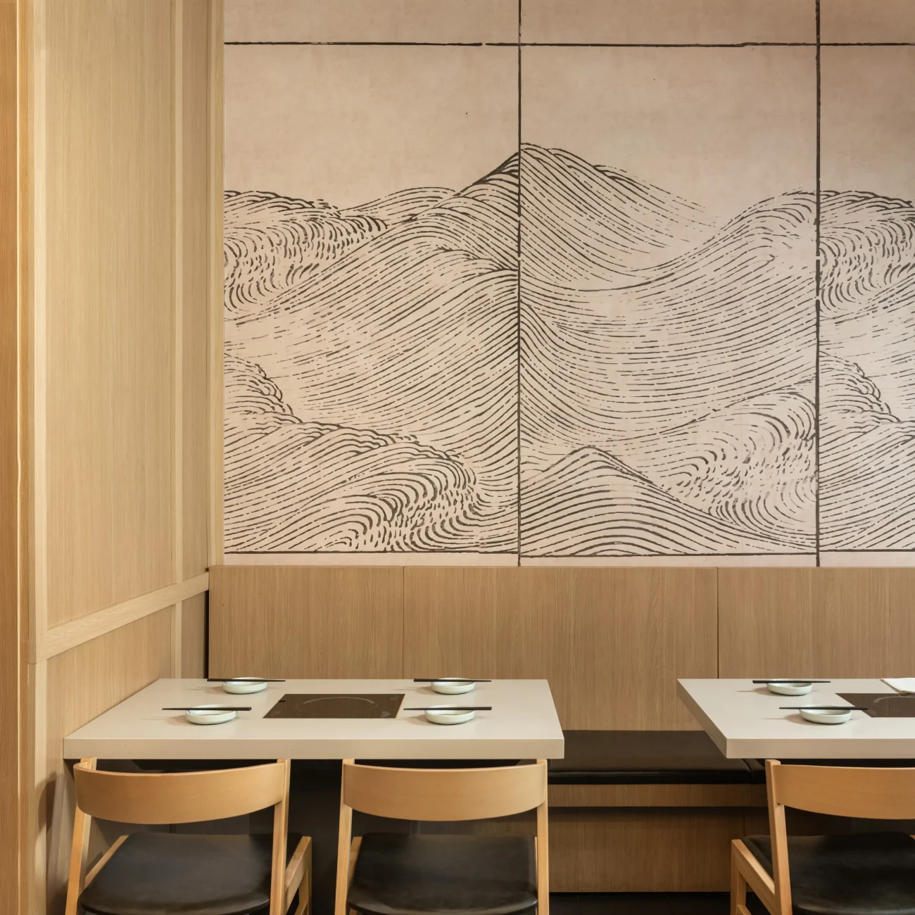 Interior Design - Interior view of a restaurant featuring wooden walls and a large mural of abstract mountain lines. Dexign Matter Studio