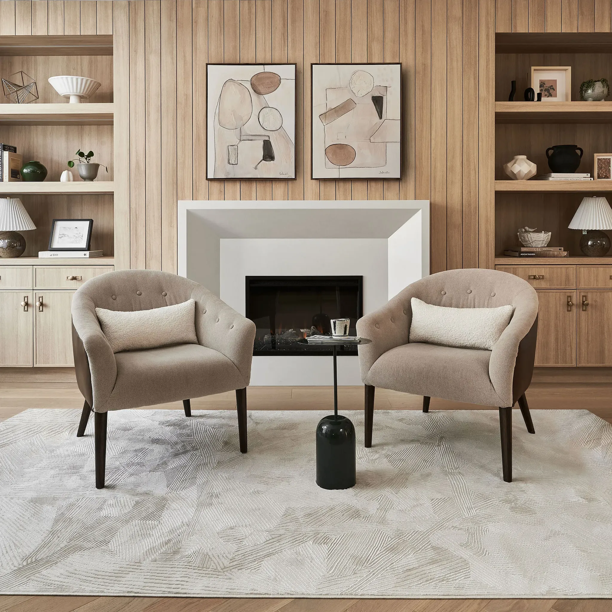 Interior Design - Two beige armchairs positioned around a black coffee table in a modern interior setting. Dexign Matter Studio